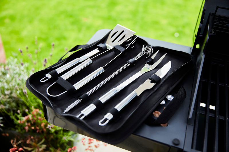 Close up of Swan BBQ Tool set spread open on the Swan Kansas 3 Burner Gas BBQ with Side Burner
