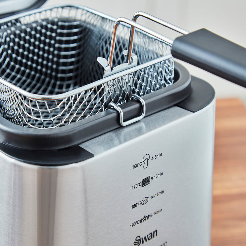 Close-up of the Swan 1.5 Litre Stainless Steel Fryer with its frying basket resting inside