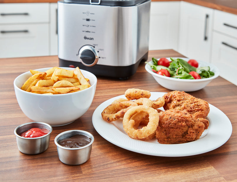 Close-up of fried onion rings, chips and chicken cooked with the Swan 1.5 Litre Stainless Steel Fryer