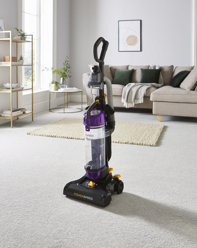 The Swan Powerspeed Upright Pet Extend Vacuum in the middle of a cream living room
