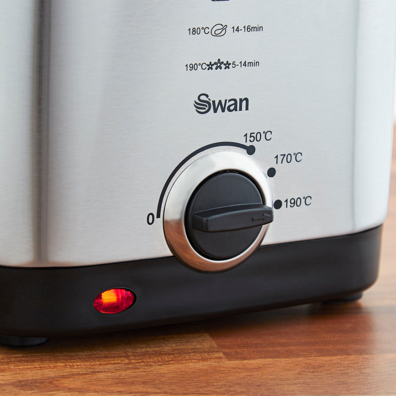 Close up of the Swan 1.5 Litre Stainless Steel Fryer's temperature controls with the red LED glowing 