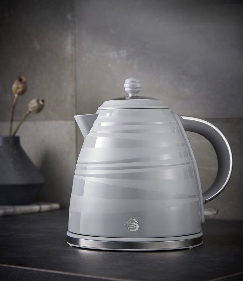 Grey Swan Symphony 1.7 Litre Jug Kettle on black counter with grey kitchen tiles in background