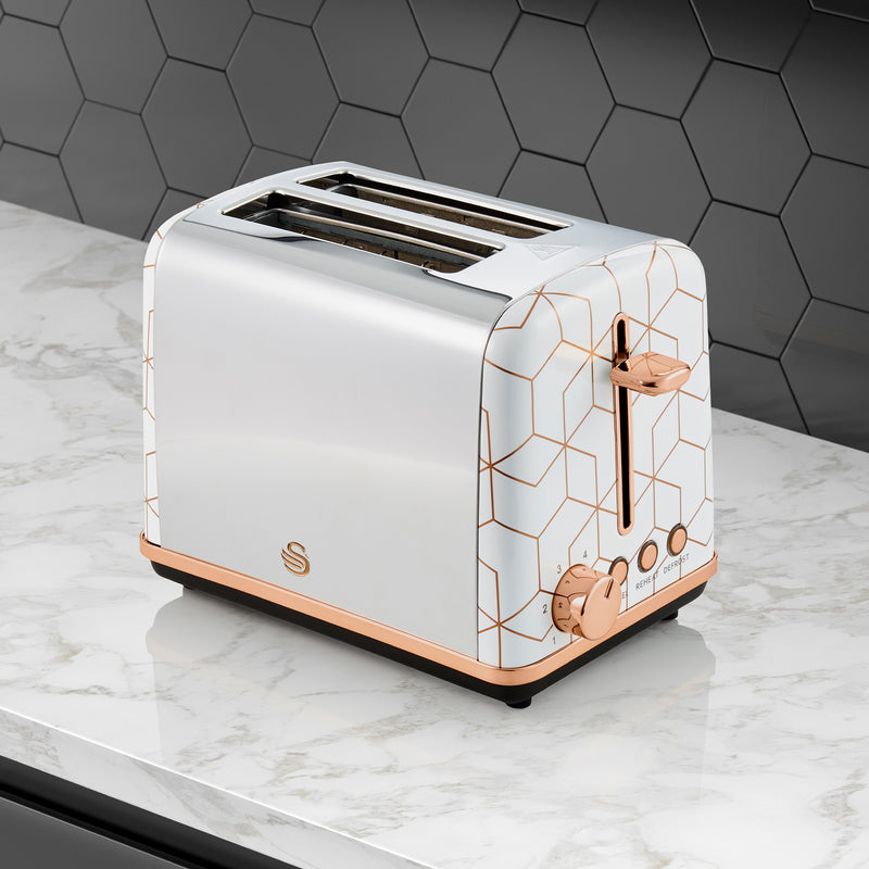 White Swan 2 Slice Tribeca Toaster with gold accents against a black kitchen tile