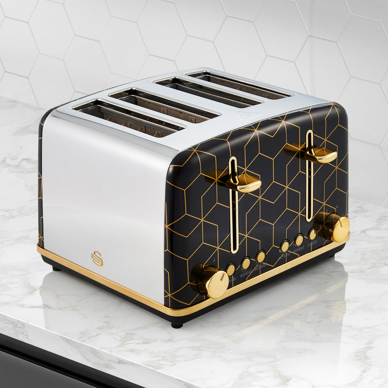 Black Swan 4 Slice Tribeca Toaster with gold accents against a white kitchen tile