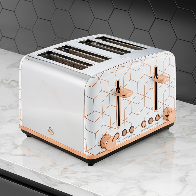White Swan 4 Slice Tribeca Toaster with gold accents against a black kitchen tile