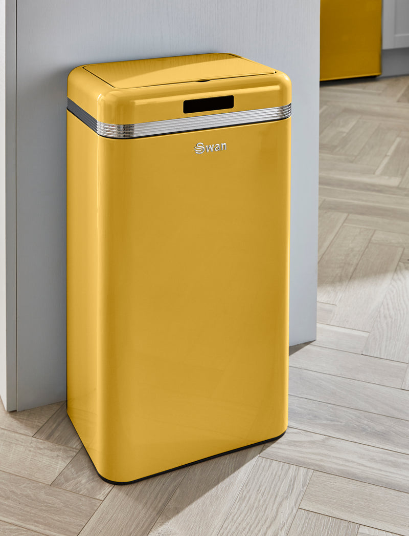 Yellow Swan Retro 45L Square Sensor Bin in a kitchen resting against a grey fridge